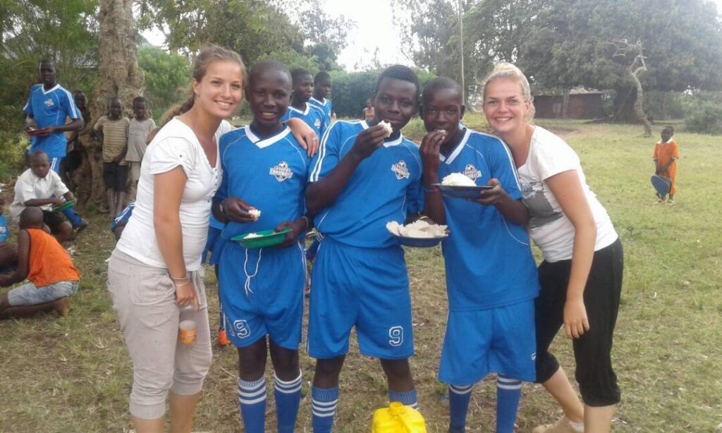 Omacan soccer team with volunteers