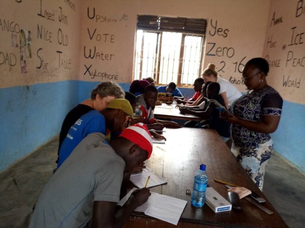 secondary students sit at table in school