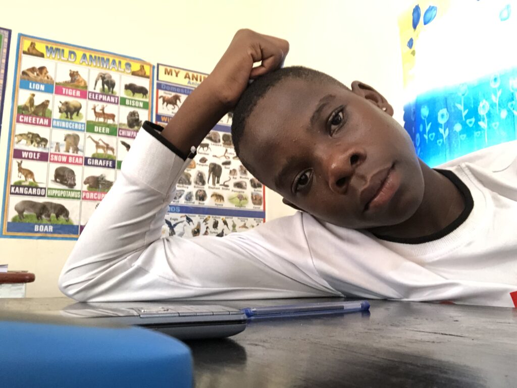 Omacan youth studying at home