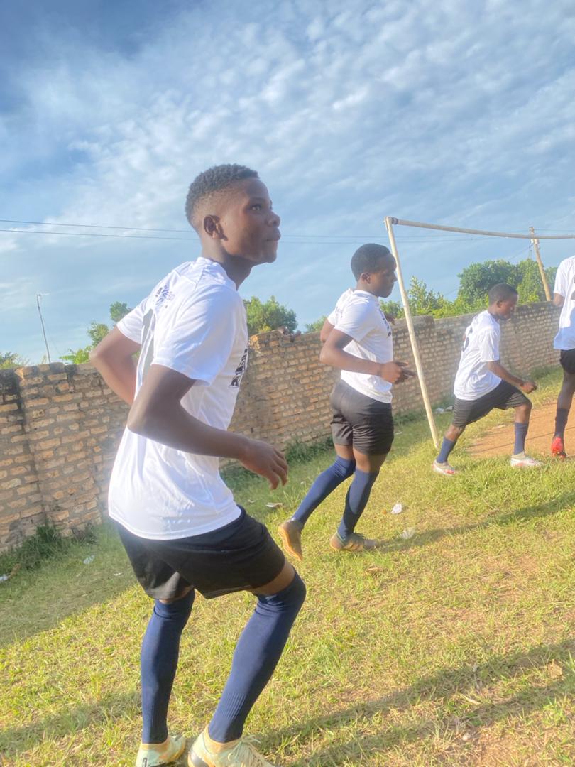 Boy in a soccer uniform at practice